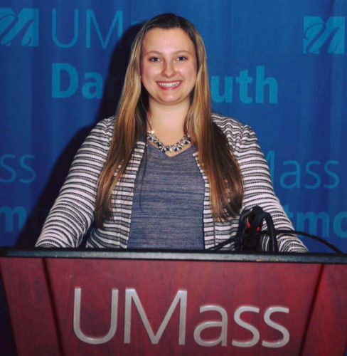 Samantha Reid, 2020 Public Interest internship participant, behind a lectern