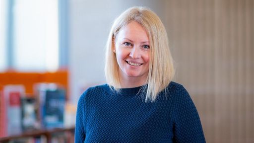 Student viktoriya balabanova standing in the library