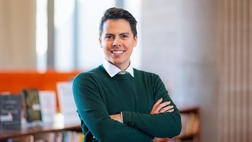 student john lucas guimaraes in the library