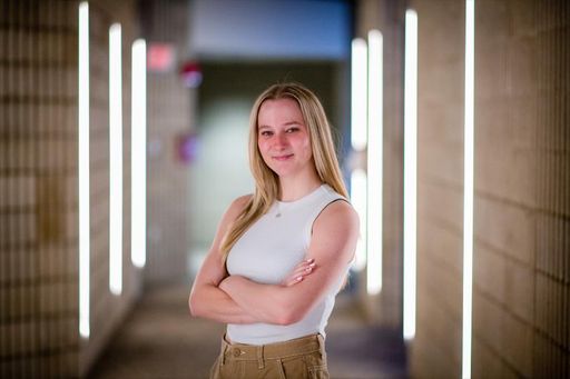 Bioengineering student Jackie Horgan standing in Textiles hallway