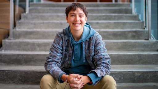 Bee Greenberg seated on library stairs