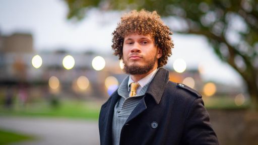 Student Percy Williams standing outside on UMassD campus
