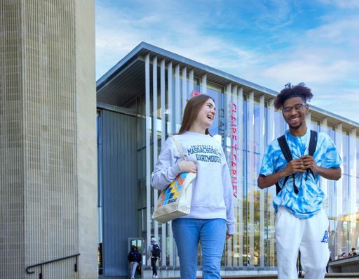 Veilleux and business student Matthew Knight walking into the campus quad