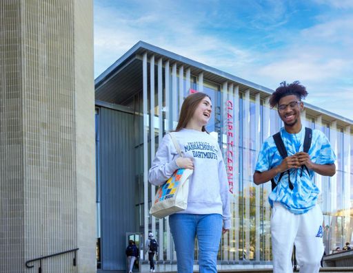 Veilleux and business student Matthew Knight walking into the campus quad