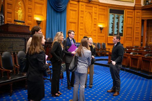 Riley and classmates tour the House Chamber at the Massachusetts State House.