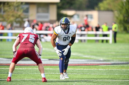 Alexander lines up across from an Anna Maria College right tackle in a fall 2025 away game.