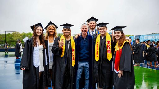 Collin Farr and classmates with Chancellor Fuller during lineup ahead of Commencement