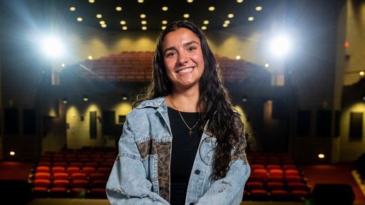 Antonella Goncalves sitting in the auditorium