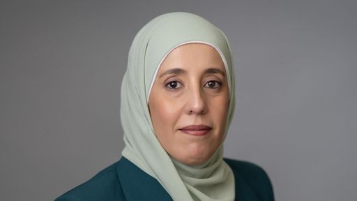 Headshot of Fatima Alzyoud '22 in front of a gray background