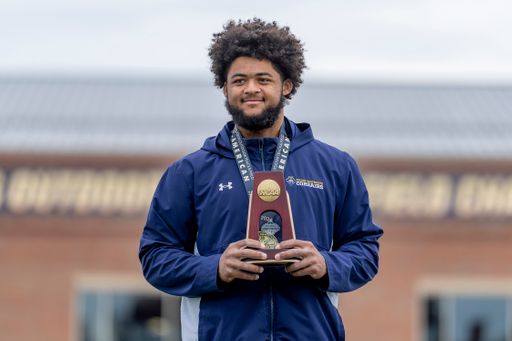 Ancil Alexander pictured with his All-American medal and trophy at the 2026 Track & Field National Championships