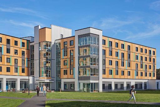 Exterior view of the first-year residence hall, featuring the building’s facade and entrance area.