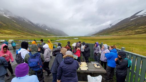 Students break for lunch in Héðinsfjörður after taking water and sediment samples in the fjord.