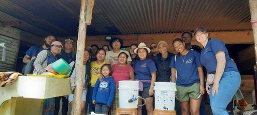 UMassD students pose with local Guatemalans during their alternative spring break