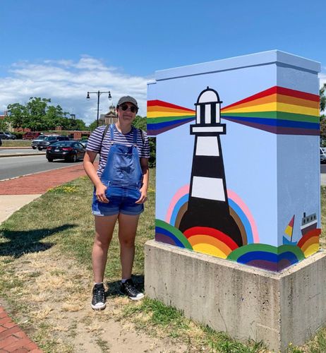BFA student Caro Cuevas, 2022 winner, poses with electrical box in New Bedford.