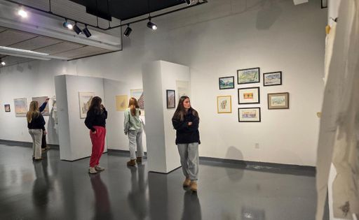 Students observe the Tamotsu Yamamoto: You Have No Choice exhibit in the CVPA Campus Gallery