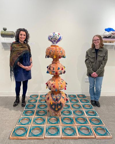 Anis Beigzadeh (left) and Fallon Navarro (right) at the Earthworks Ceramics exhibition at the Umbrella Arts Center in Concord, MA.