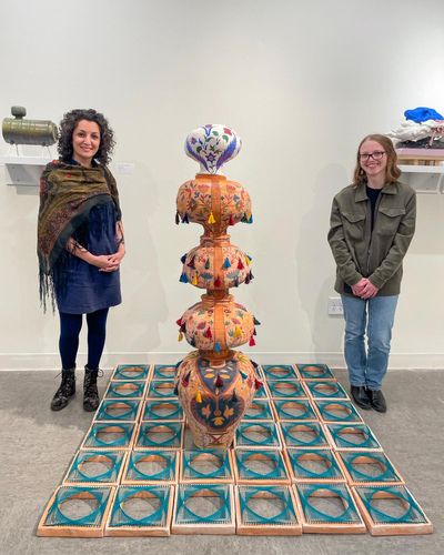 Anis Beigzadeh (left) and Fallon Navarro (right) at the Earthworks Ceramics exhibition at the Umbrella Arts Center in Concord, MA.