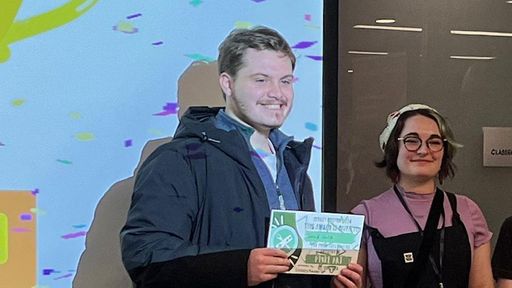 Jared Gula '24 accepts his award for 