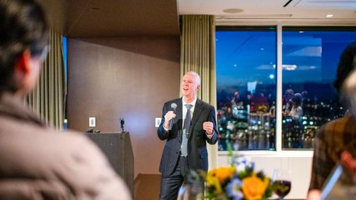 UMass Dartmouth Chancellor Mark Fuller addresses a room of alumni, business leaders, and legislators in Boston.