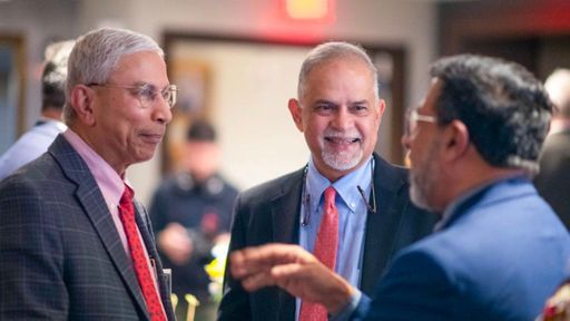 Left to right: UMass Boston College of Management Dean Venky Venkatachalam, Charlton College of Business Dean Madan Annavarjula, and UMassD Provost Ramprasad Balasubramanian.