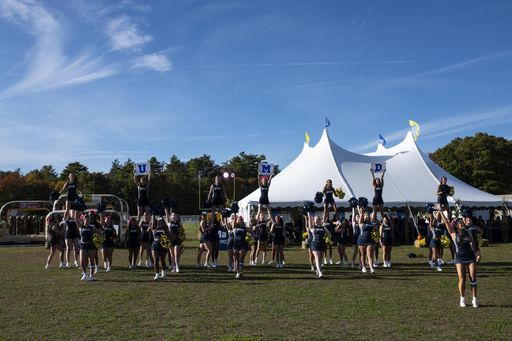 UMassD Cheerleaders performing at Alumni Tent
