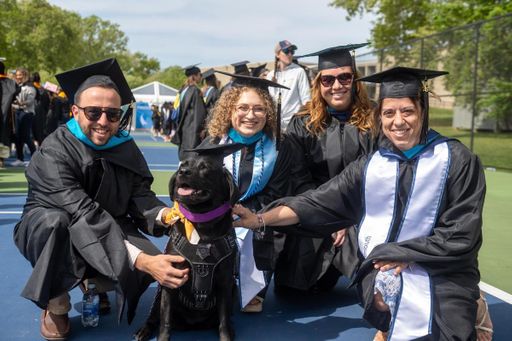 Students pictured with UMassD K9 Bella at lineup.