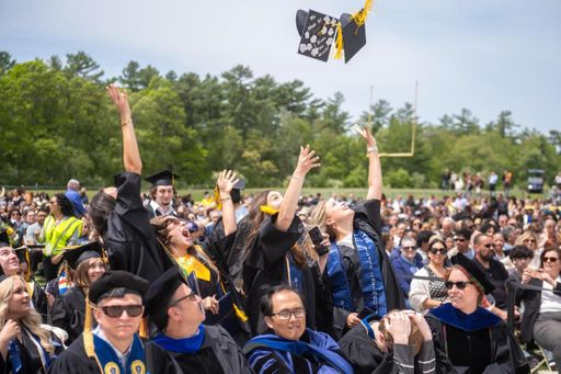 Students tossing their caps after the culmination of Commencement 2026.