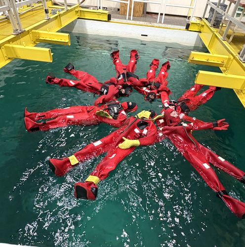 Students in survival suits in the test tank at SMAST