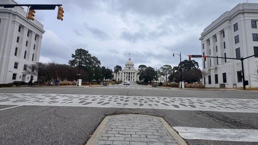 The Alabama State Capitol in Montgomery marks the end of the 1965 Selma to Montgomery voting rights march, commemorated by footprints embedded in the crosswalk.