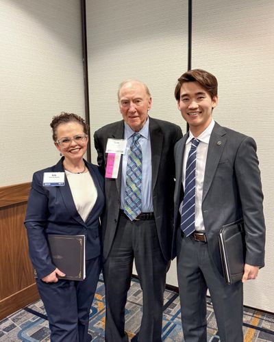 Hancock (left) and Milo Young (right) pictured with Evan J. Spelfogel, Esq., who introduced the writing award winners.