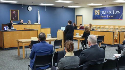 An attorney presents her oral argument in UMass Law's Francis J. Larkin Moot Court Room.