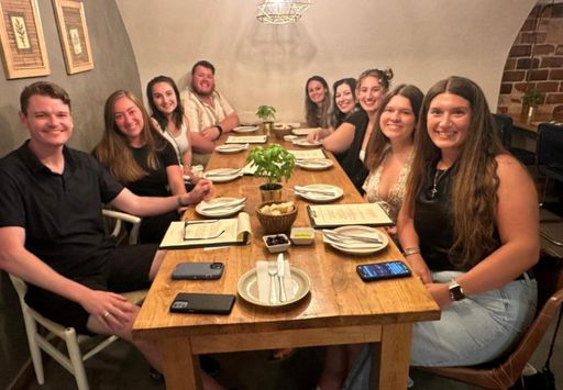 UMass Law students gather for a meal in Lisbon, Portugal.