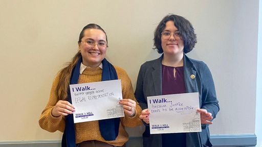 UMass Law students pose with the reason they walk—because everyone deserves legal representation and because justice needs to be accessible.