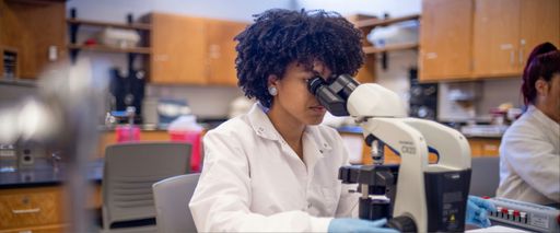 MLS Student sitting in laboratory