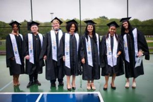 UMassD Online Students posing at commencement ceremony