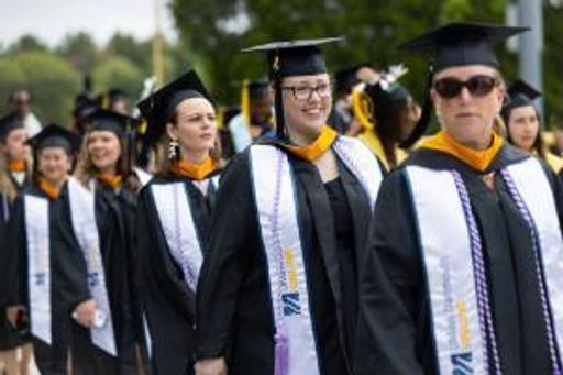Online students in line at commencement