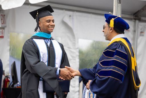 Online student receiving diploma