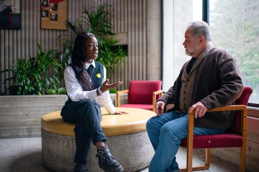 Student speaking with faculty