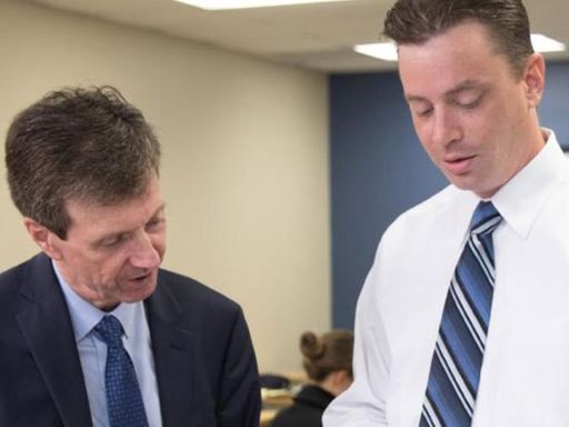 UMass Law faculty and student