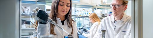 Microbiology graduate student, Yousra Bendarkawi MS '24, in the lab with Professor Mark Silby