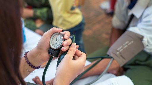 Nurse taking blood pressure