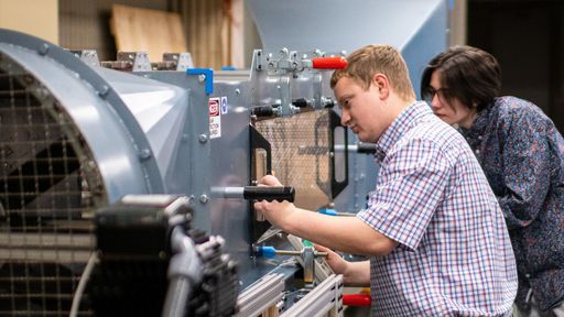 Mechanical engineering senior design students conducting research in the FSI lab