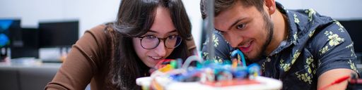 Electrical Engineering student, Erika Caushi '23 MS '24 and Computer Science student, Cameron McAlpine '23, working in the lab