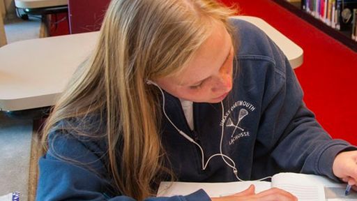 Student studying at Claire T. Carney Library