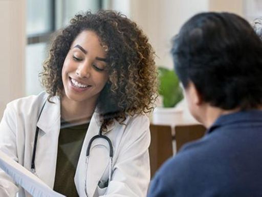 Female doctor meeting with couple