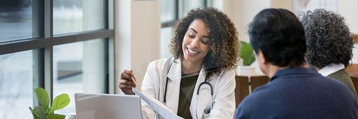 Female doctor meeting with couple