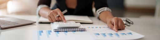 Close up of accountant calculating a financial report