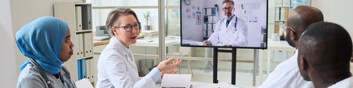 Healthcare administrator meeting with staff