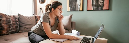 Student working on laptop from home