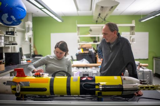 PhD student Agata Piffer Braga '24 working on an autonomous underwater vehicle (AUV) at SMAST.
